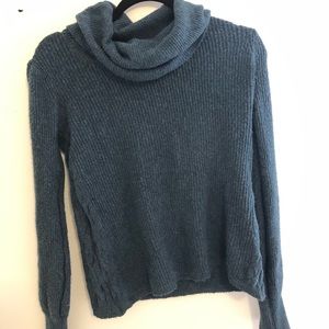 Green turtleneck sweater.